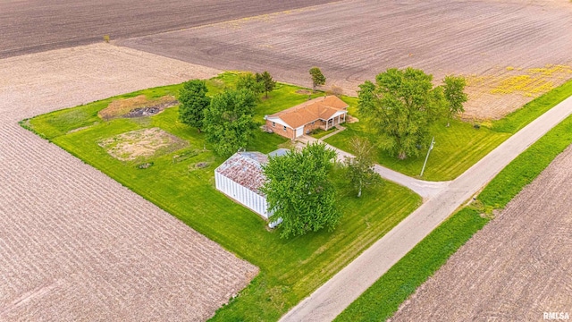 birds eye view of property with a rural view