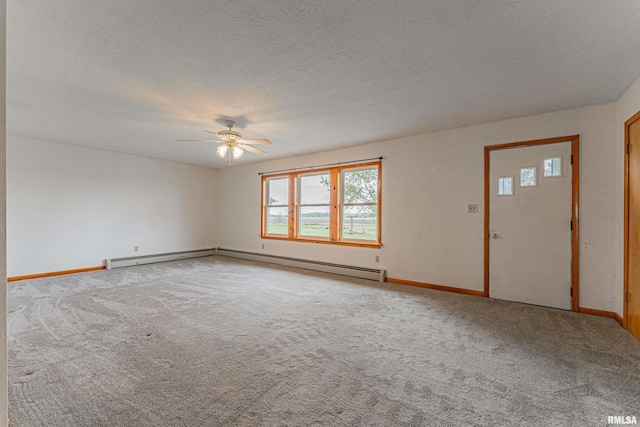 interior space featuring baseboards, a healthy amount of sunlight, and carpet