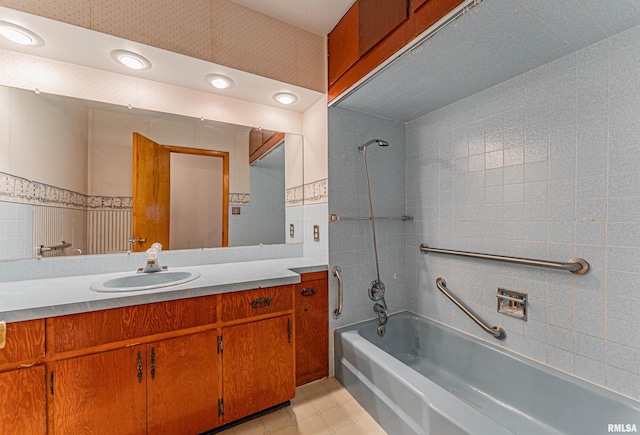 bathroom featuring vanity and washtub / shower combination