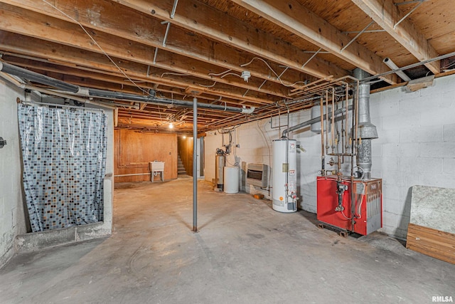 unfinished below grade area with a heating unit and water heater