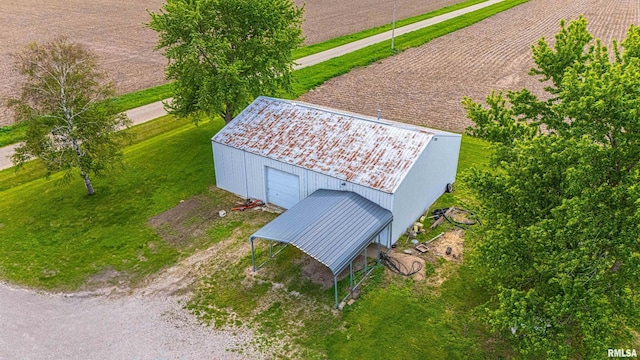 birds eye view of property with a rural view