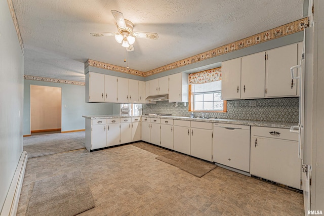 kitchen with a ceiling fan, a textured ceiling, baseboard heating, light countertops, and white dishwasher