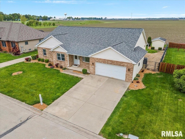 single story home featuring an attached garage, driveway, fence, and a front lawn
