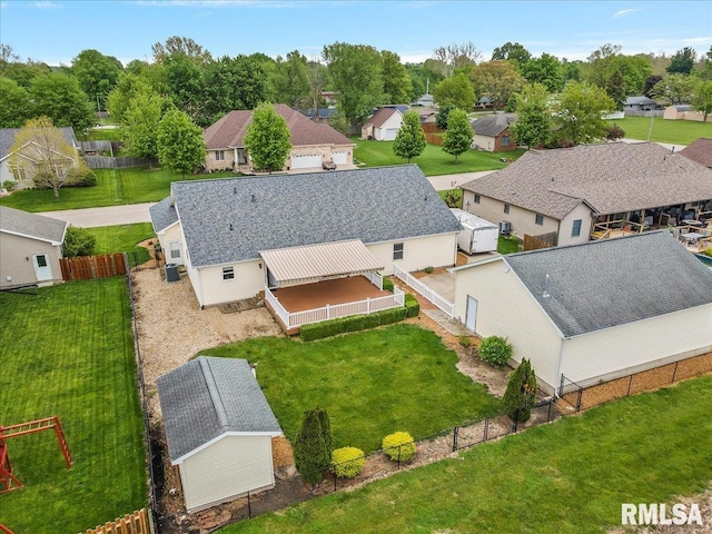 birds eye view of property with a residential view
