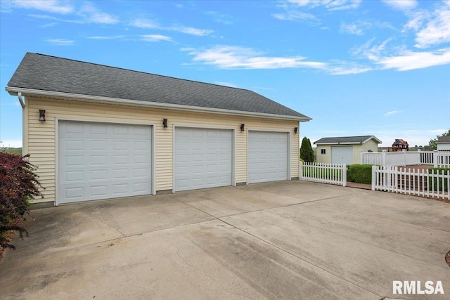 detached garage with fence
