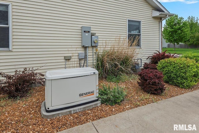 exterior details with gas meter, a power unit, and electric meter