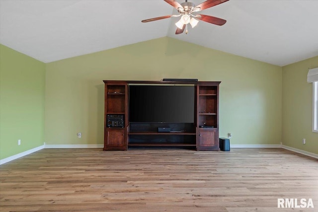 unfurnished living room featuring baseboards, vaulted ceiling, wood finished floors, and a ceiling fan