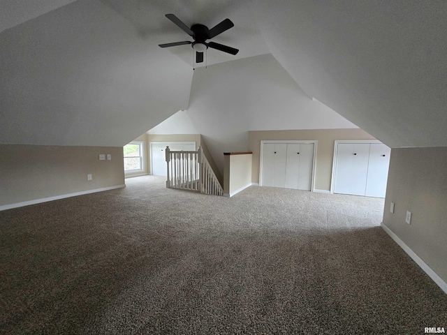 bonus room with carpet, a ceiling fan, baseboards, and lofted ceiling