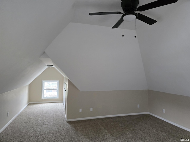 bonus room with lofted ceiling and carpet floors