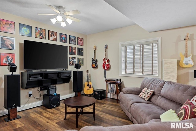 living room with wood finished floors, baseboards, and ceiling fan