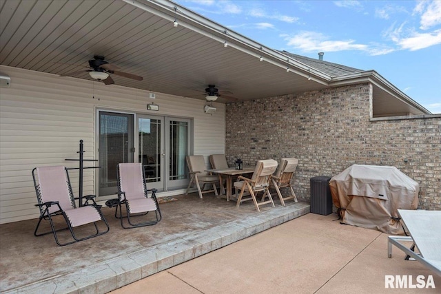 view of patio featuring a ceiling fan and a grill