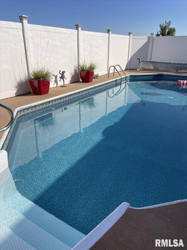 view of pool featuring fence and a fenced in pool