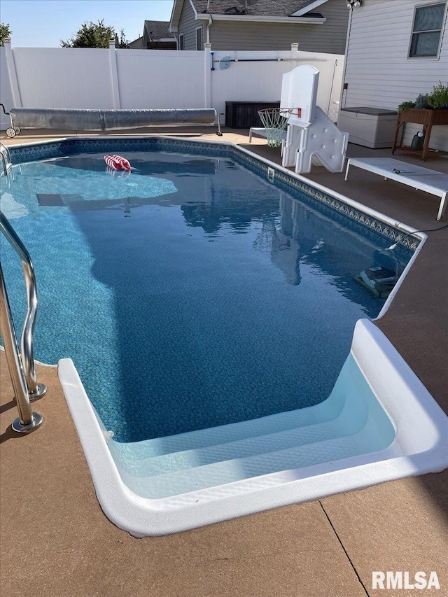 view of swimming pool with a fenced backyard and a fenced in pool