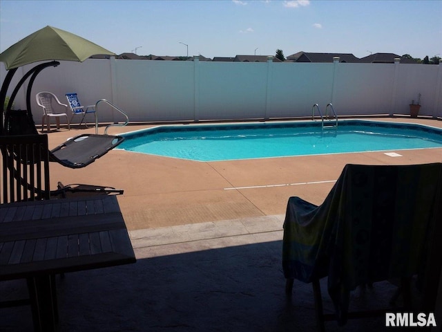 view of pool featuring a fenced backyard, a patio area, and a fenced in pool