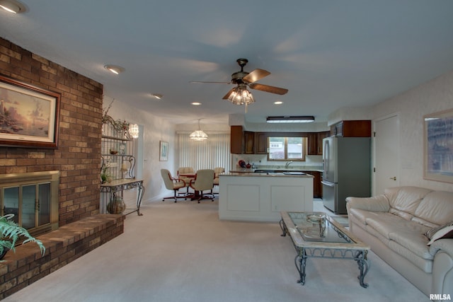 432 W Fairway Dr, Quincy, IL 62305 - living area featuring light carpet, ceiling fan, and a fireplace