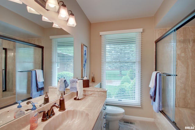 432 W Fairway Dr, Quincy, IL 62305 - bathroom with a shower with door, plenty of natural light, vanity, and toilet