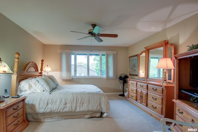 432 W Fairway Dr, Quincy, IL 62305 - bedroom featuring light carpet, a ceiling fan, and baseboards