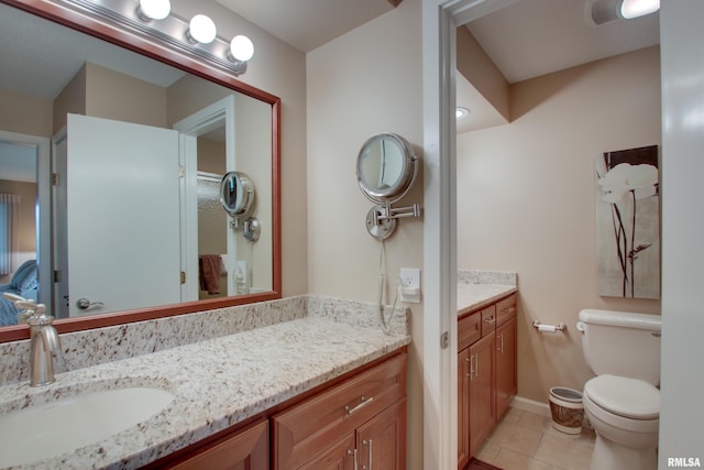 432 W Fairway Dr, Quincy, IL 62305 - bathroom with vanity, tile patterned floors, and toilet