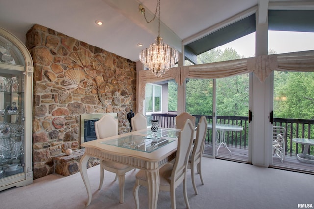 432 W Fairway Dr, Quincy, IL 62305 - dining area featuring carpet floors, lofted ceiling, a chandelier, recessed lighting, and a stone fireplace