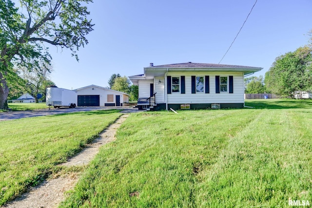 view of front facade featuring a garage, a front lawn, an outdoor structure, and a chimney