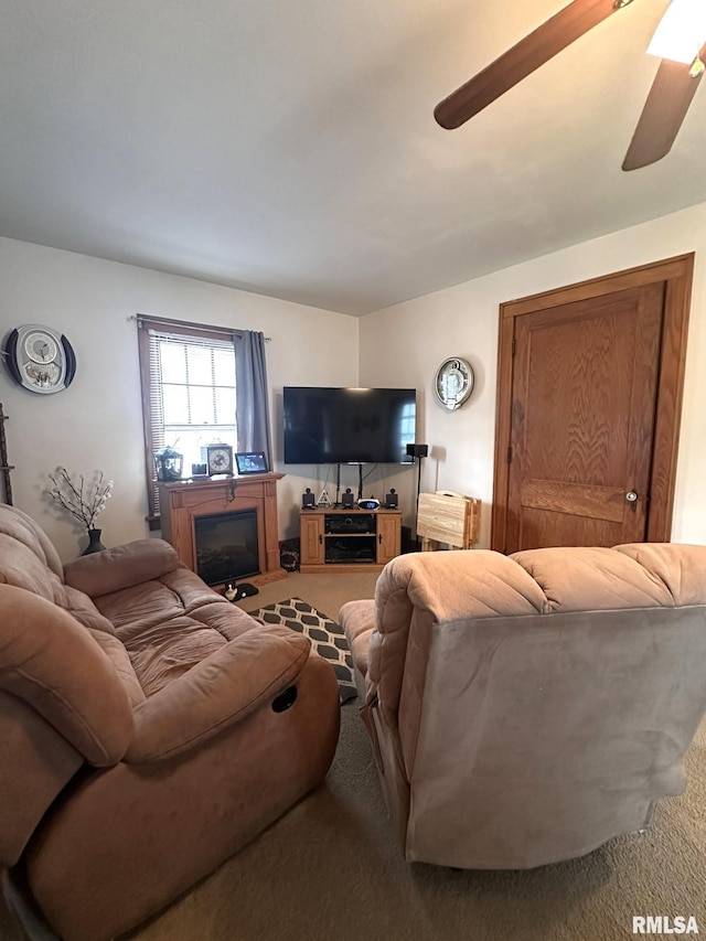 277 N Ivan Ave, Galesburg, IL 61401 - carpeted living room featuring ceiling fan and a glass covered fireplace