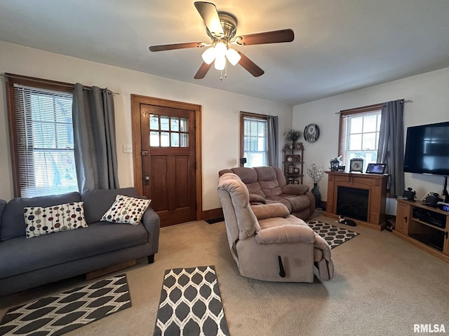 277 N Ivan Ave, Galesburg, IL 61401 - living room with carpet flooring, healthy amount of natural light, a fireplace, and a ceiling fan
