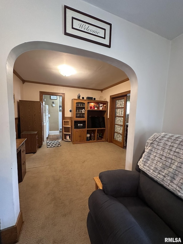 277 N Ivan Ave, Galesburg, IL 61401 - living room with arched walkways, light colored carpet, and crown molding