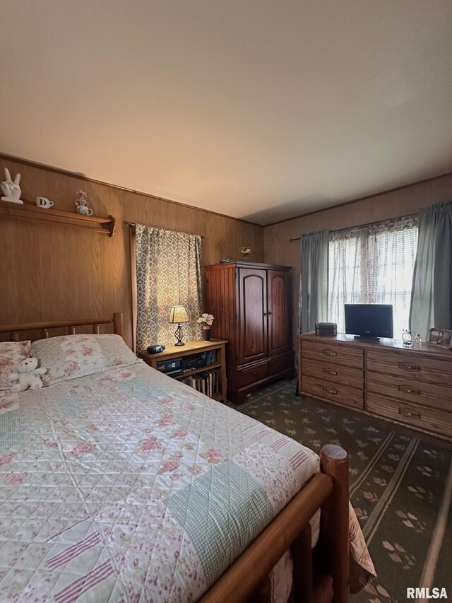277 N Ivan Ave, Galesburg, IL 61401 - bedroom with wooden walls and dark carpet