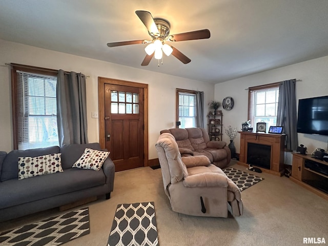 277 N Ivan Ave, Galesburg, IL 61401 - living area with light carpet, a ceiling fan, and a fireplace