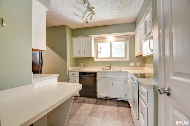 2628 S Forrest Green Dr, Decatur, IL 62521 - kitchen with white appliances, track lighting, light countertops, white cabinets, and a textured ceiling