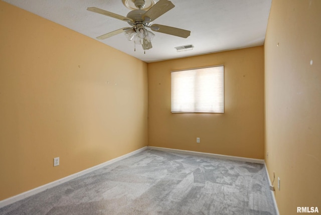 2628 S Forrest Green Dr, Decatur, IL 62521 - unfurnished room featuring carpet flooring and a ceiling fan