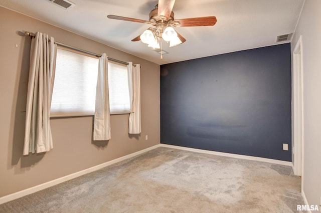 2628 S Forrest Green Dr, Decatur, IL 62521 - carpeted empty room with ceiling fan and baseboards