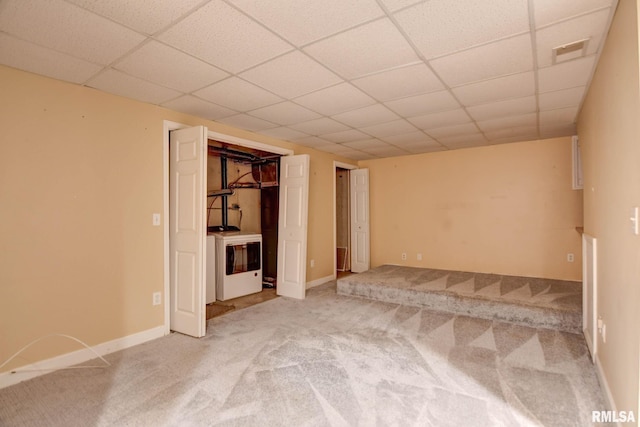 2628 S Forrest Green Dr, Decatur, IL 62521 - unfurnished room featuring light colored carpet, washer / dryer, and a paneled ceiling