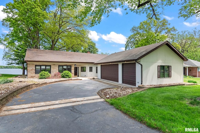 188 E Hazel Dell Ln, Springfield, IL 62712 - single story home with an attached garage, driveway, and a front lawn