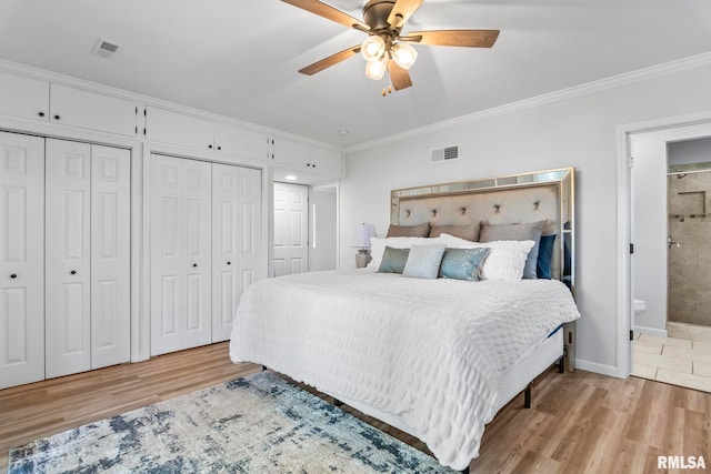 188 E Hazel Dell Ln, Springfield, IL 62712 - bedroom featuring light wood-style floors, crown molding, two closets, baseboards, and connected bathroom