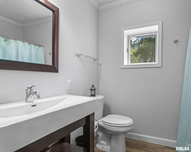 188 E Hazel Dell Ln, Springfield, IL 62712 - bathroom with wood finished floors, ornamental molding, baseboards, toilet, and vanity