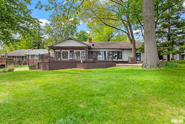 188 E Hazel Dell Ln, Springfield, IL 62712 - rear view of property featuring a wooden deck, a lawn, and a chimney