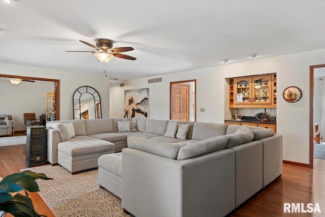 1405 Woods Farm Ln, Springfield, IL 62704 - living area featuring ceiling fan, wood finished floors, and baseboards