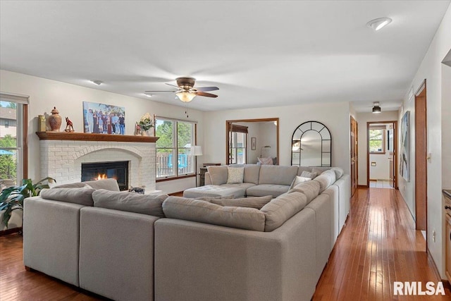 1405 Woods Farm Ln, Springfield, IL 62704 - living area featuring ceiling fan, a fireplace, and hardwood / wood-style floors