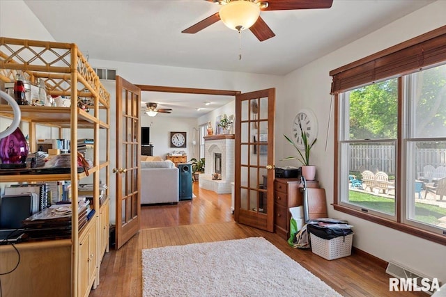 1405 Woods Farm Ln, Springfield, IL 62704 - office featuring french doors, a ceiling fan, wood finished floors, and baseboards
