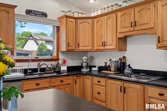 1405 Woods Farm Ln, Springfield, IL 62704 - kitchen with a sink, dark countertops, decorative backsplash, vaulted ceiling, and stainless steel electric cooktop