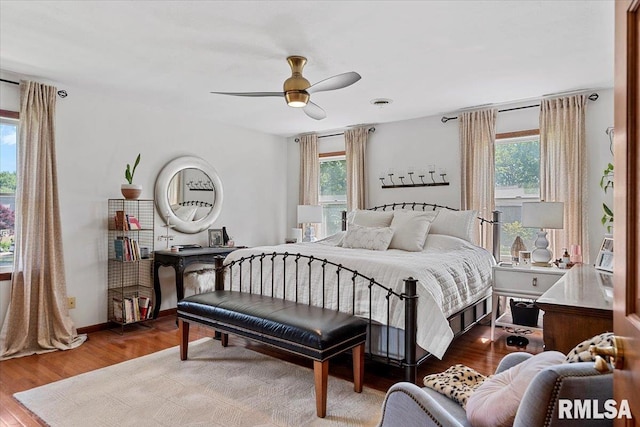 1405 Woods Farm Ln, Springfield, IL 62704 - bedroom featuring multiple windows, wood finished floors, and baseboards