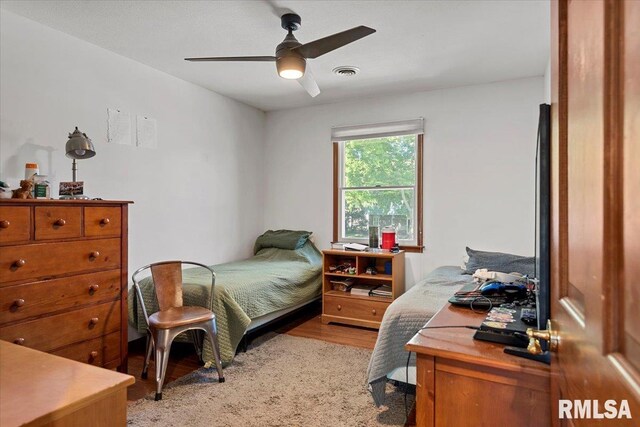 1405 Woods Farm Ln, Springfield, IL 62704 - bedroom with light wood-type flooring and ceiling fan