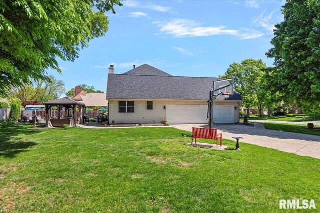 1405 Woods Farm Ln, Springfield, IL 62704 - back of house with a gazebo, concrete driveway, and a garage