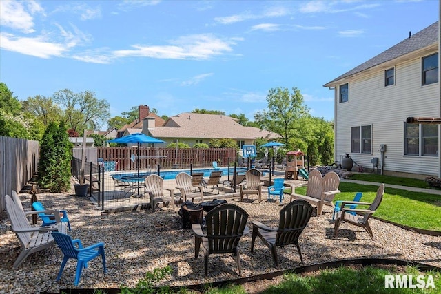 1405 Woods Farm Ln, Springfield, IL 62704 - fenced backyard with an outdoor fire pit and a patio