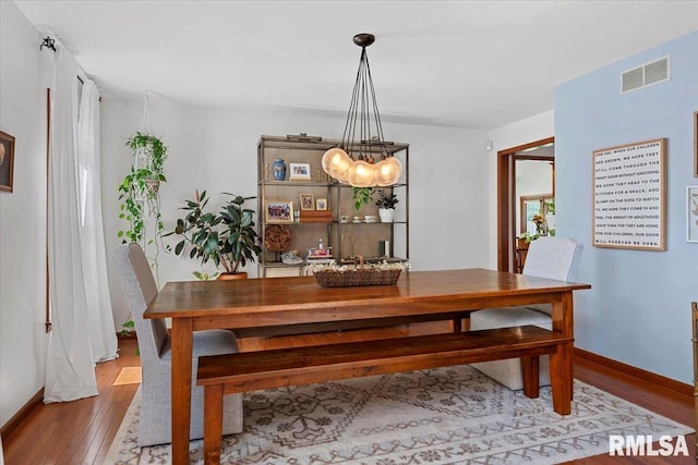 1405 Woods Farm Ln, Springfield, IL 62704 - dining area with wood finished floors and baseboards