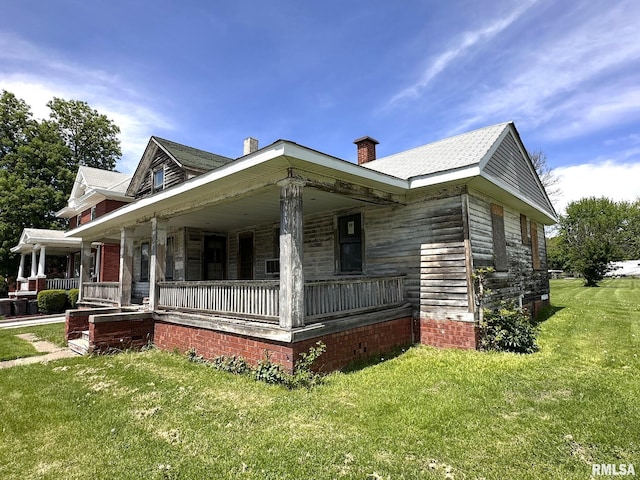 1309 E Main St, Galesburg, IL 61401 - view of front of property with a porch and a front lawn