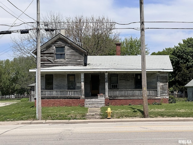 1309 E Main St, Galesburg, IL 61401 - view of front of house with a chimney, a porch, and a front yard