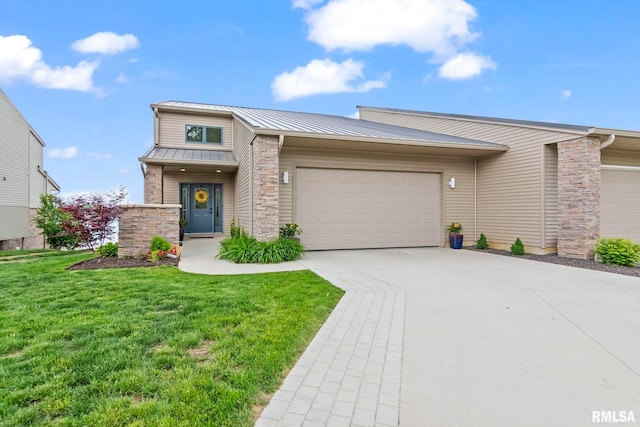 321 Harbor Point Pl, Springfield, IL 62712 - view of front of home with stone siding, a standing seam roof, driveway, a garage, and a front lawn