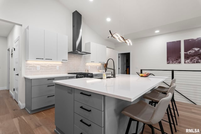 321 Harbor Point Pl, Springfield, IL 62712 - kitchen with wall chimney range hood, gray cabinetry, modern cabinets, backsplash, and a sink